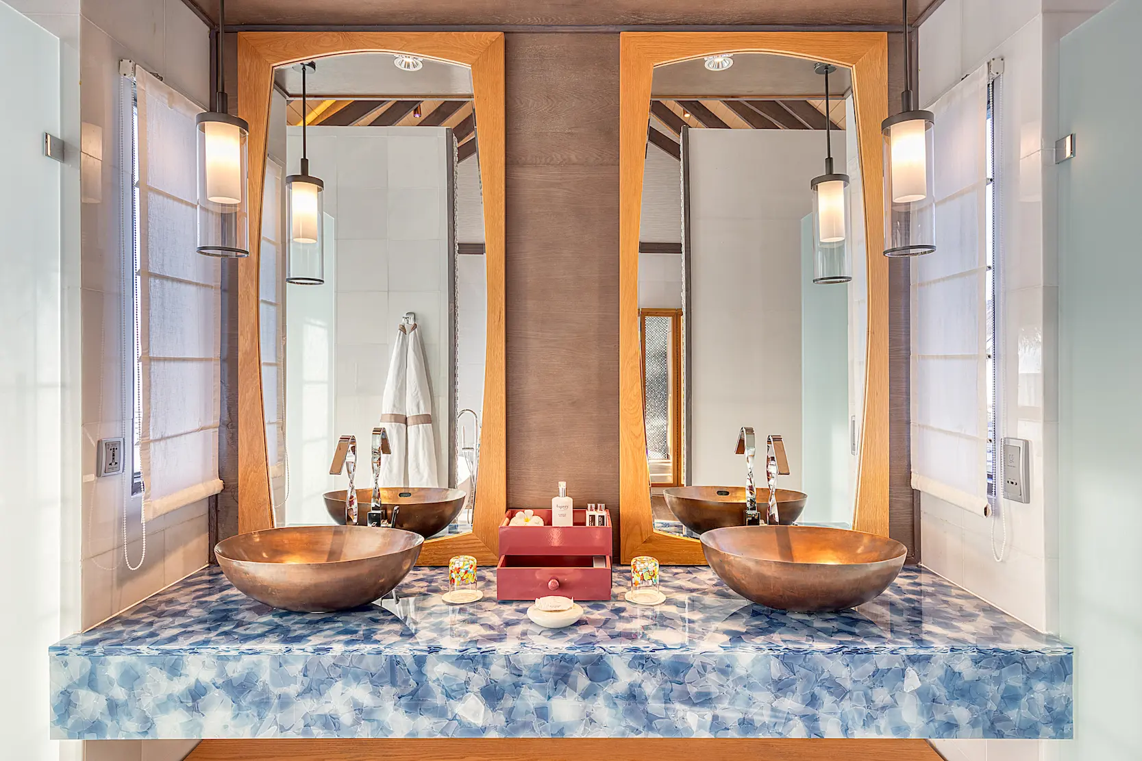 Bathroom in a Wind Villa with Pool at OZEN LIFE MAADHOO featuring a freestanding bathtub, contemporary design and views across the lagoon from the overwater setting