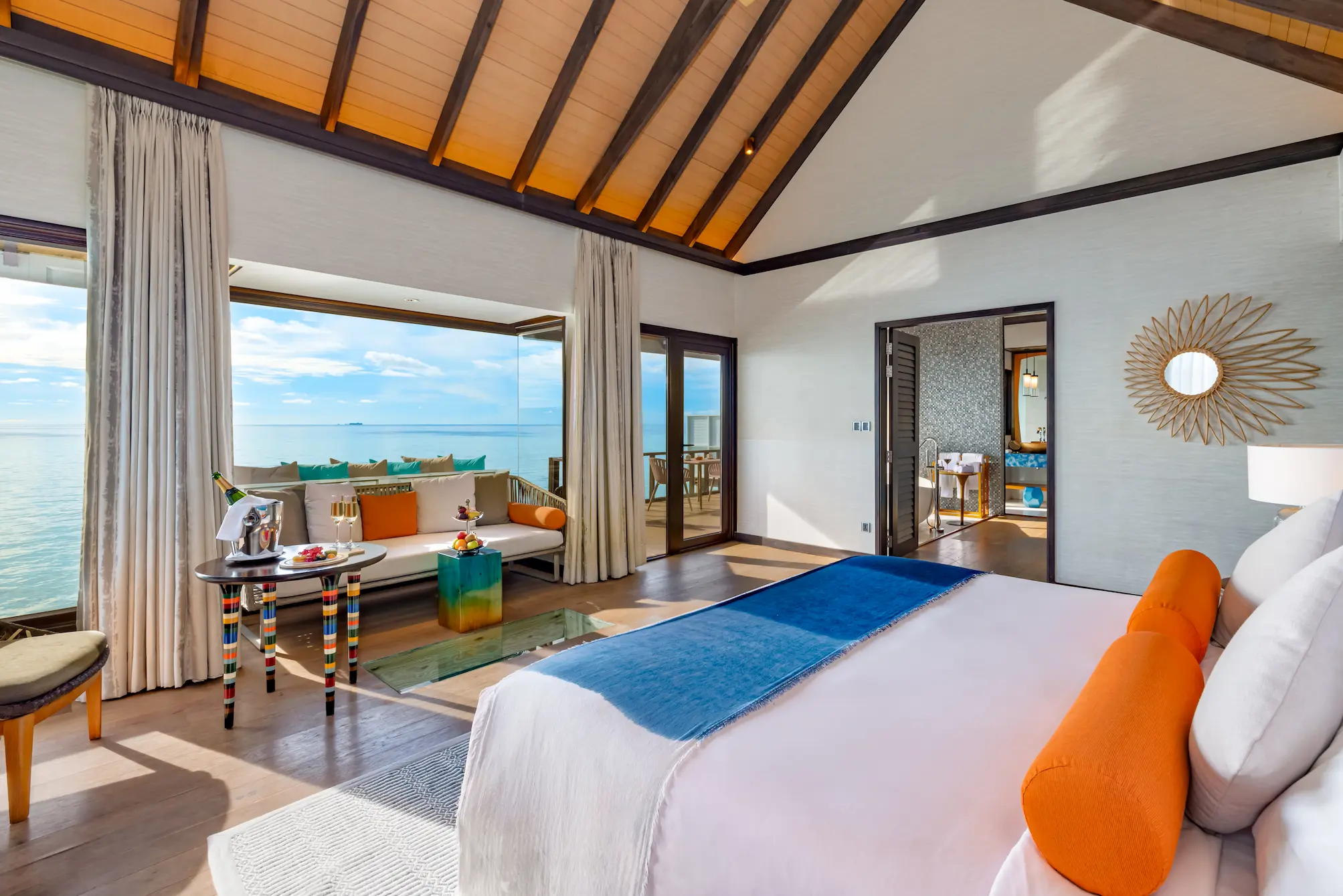 Bedroom in a Wind Villa with Pool at OZEN LIFE MAADHOO featuring contemporary overwater accommodation, elegant interiors and views across the lagoon