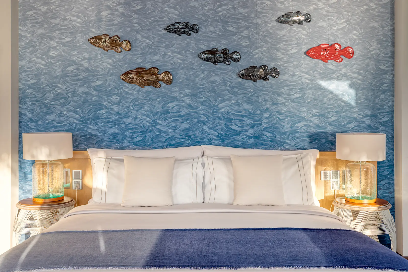 Contemporary bedroom décor in a Wind Villa with Pool at OZEN LIFE MAADHOO, featuring elegant furnishings, overwater accommodation and views across the lagoon.