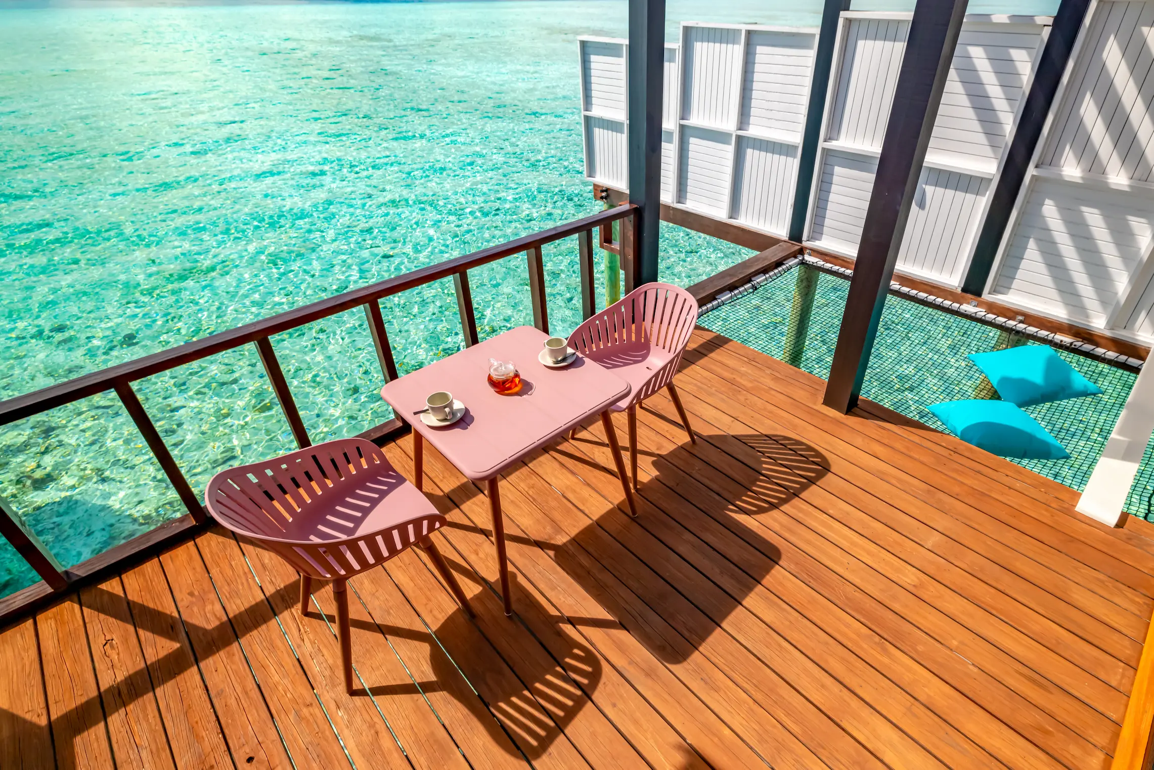 Private overwater deck at a Wind Villa with Pool at OZEN LIFE MAADHOO, featuring direct lagoon access and views across the Indian Ocean