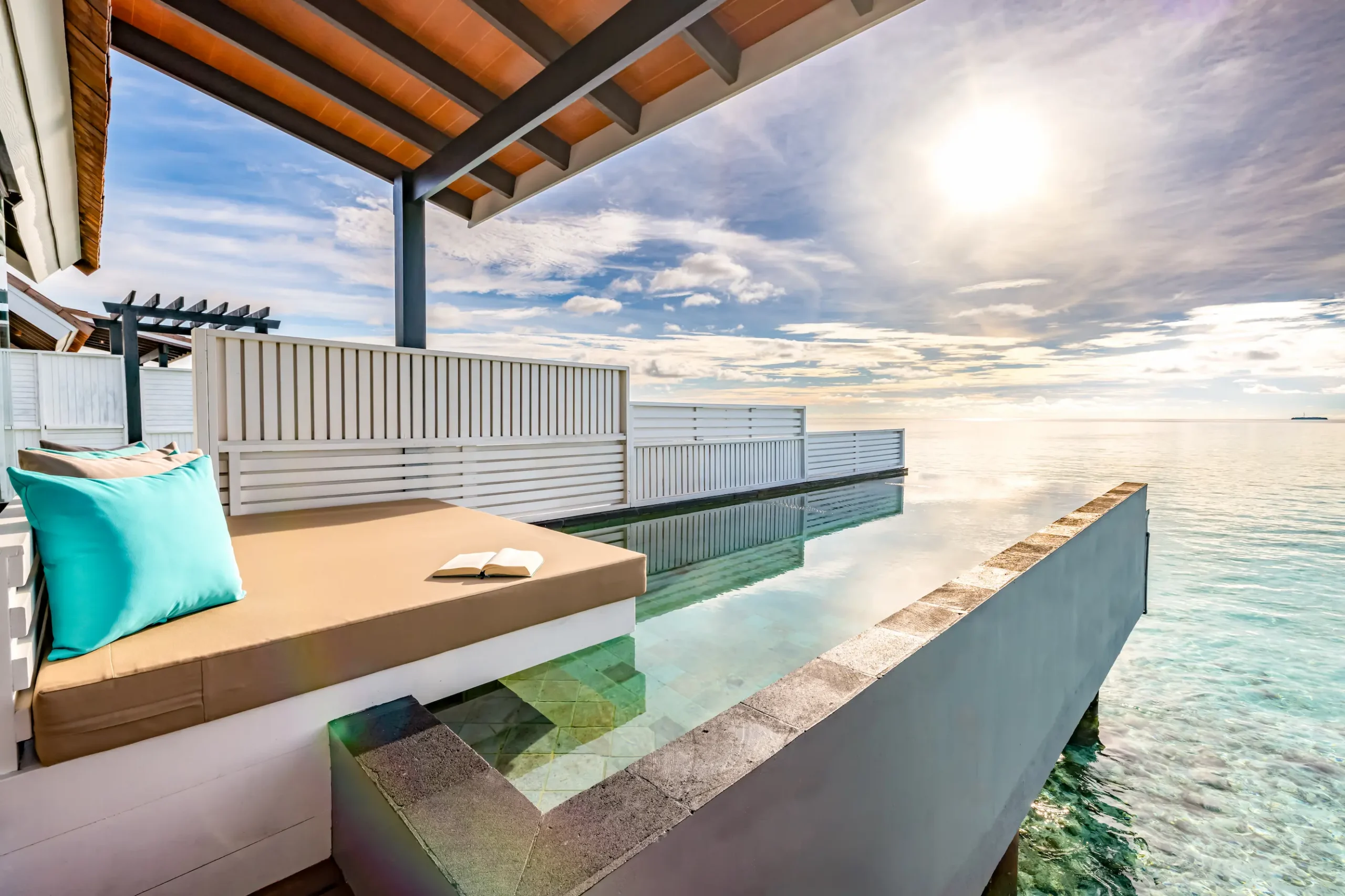 Private infinity pool at a Wind Villa with Pool at OZEN LIFE MAADHOO, overlooking the lagoon from the resort's overwater accommodation