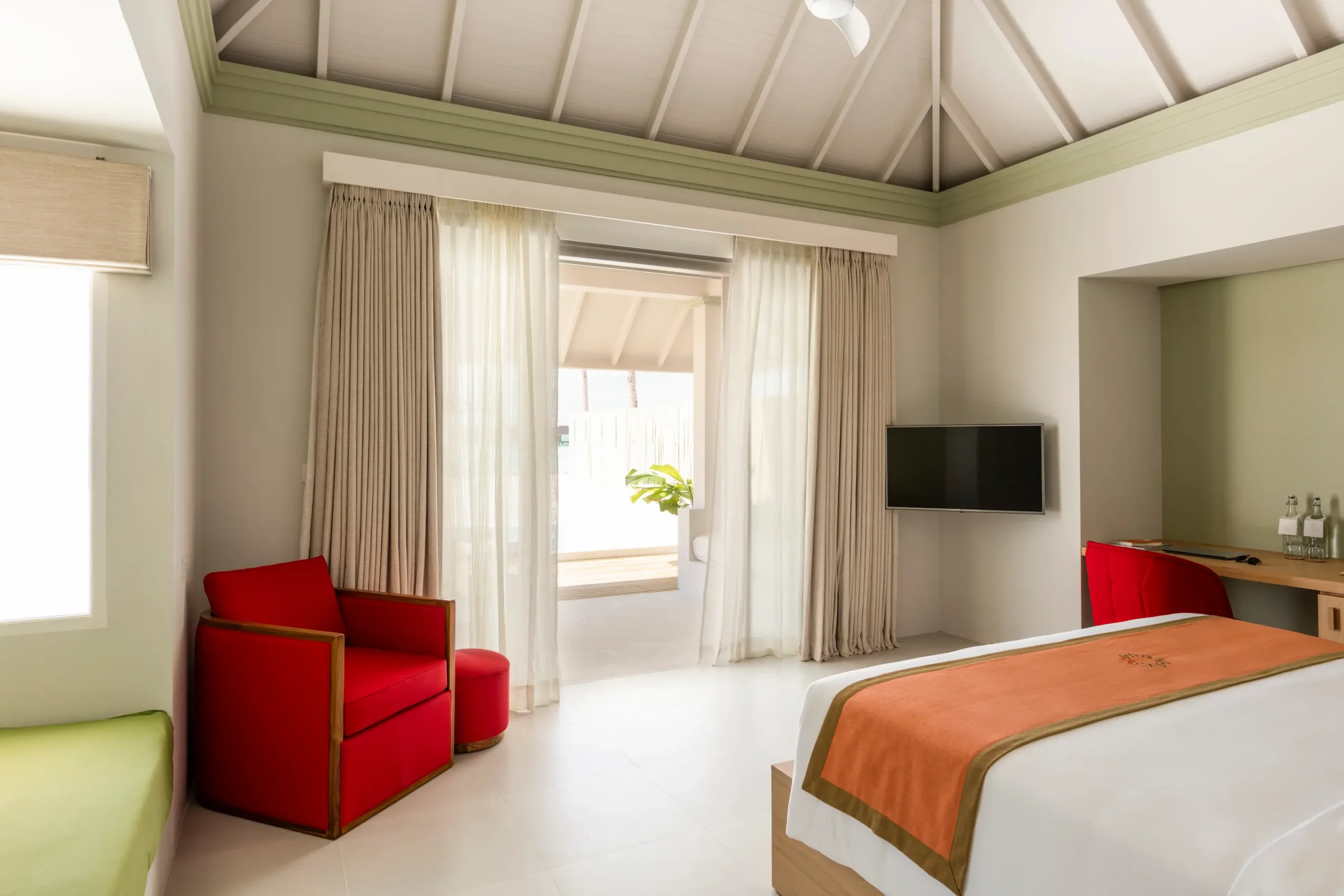 bedroom interior of a grand beach villa with pool at sun siyam olhuveli maldives featuring contemporary furnishings and beachside accommodation