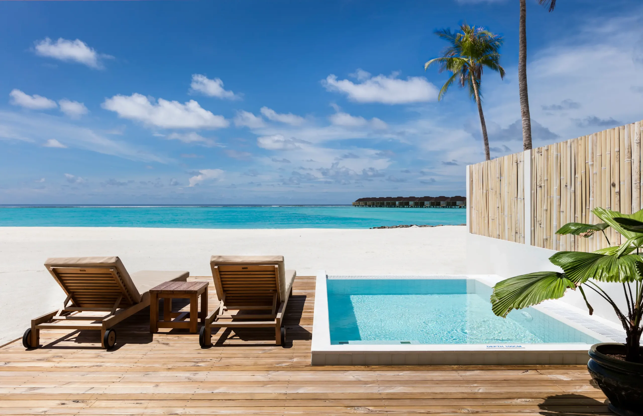 private terrace of a grand beach villa with pool at sun siyam olhuveli maldives featuring outdoor seating and beachfront access