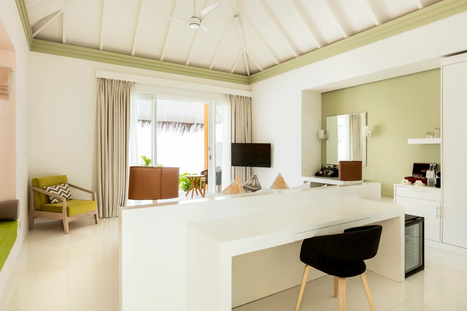 interior of a grand beach villa at sun siyam olhuveli maldives featuring contemporary furnishings and spacious beachfront accommodation
