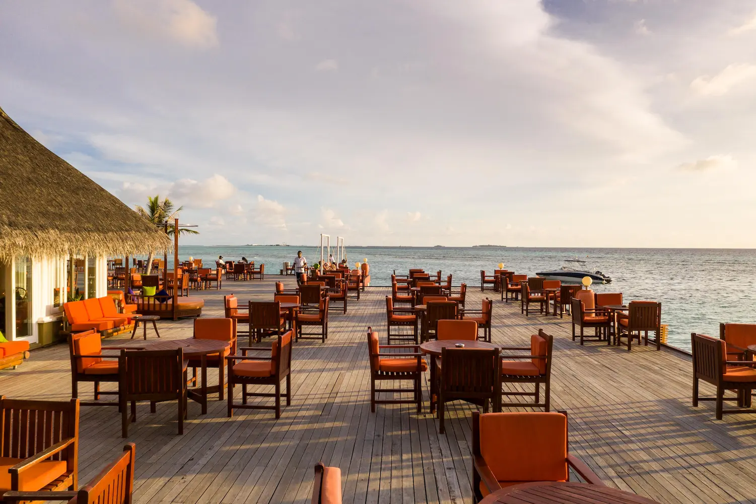 lagoon bar at sun siyam olhuveli maldives offering overwater drinks and evening entertainment above the lagoon