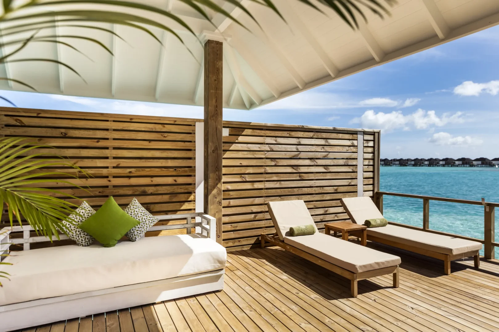 private terrace of a grand water villa at sun siyam olhuveli maldives with direct access to the lagoon