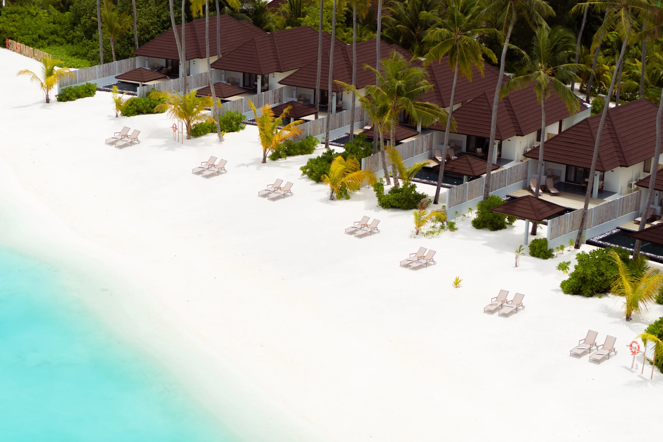 aerial view of grand beach suites with pool at sun siyam olhuveli maldives located along the beachfront