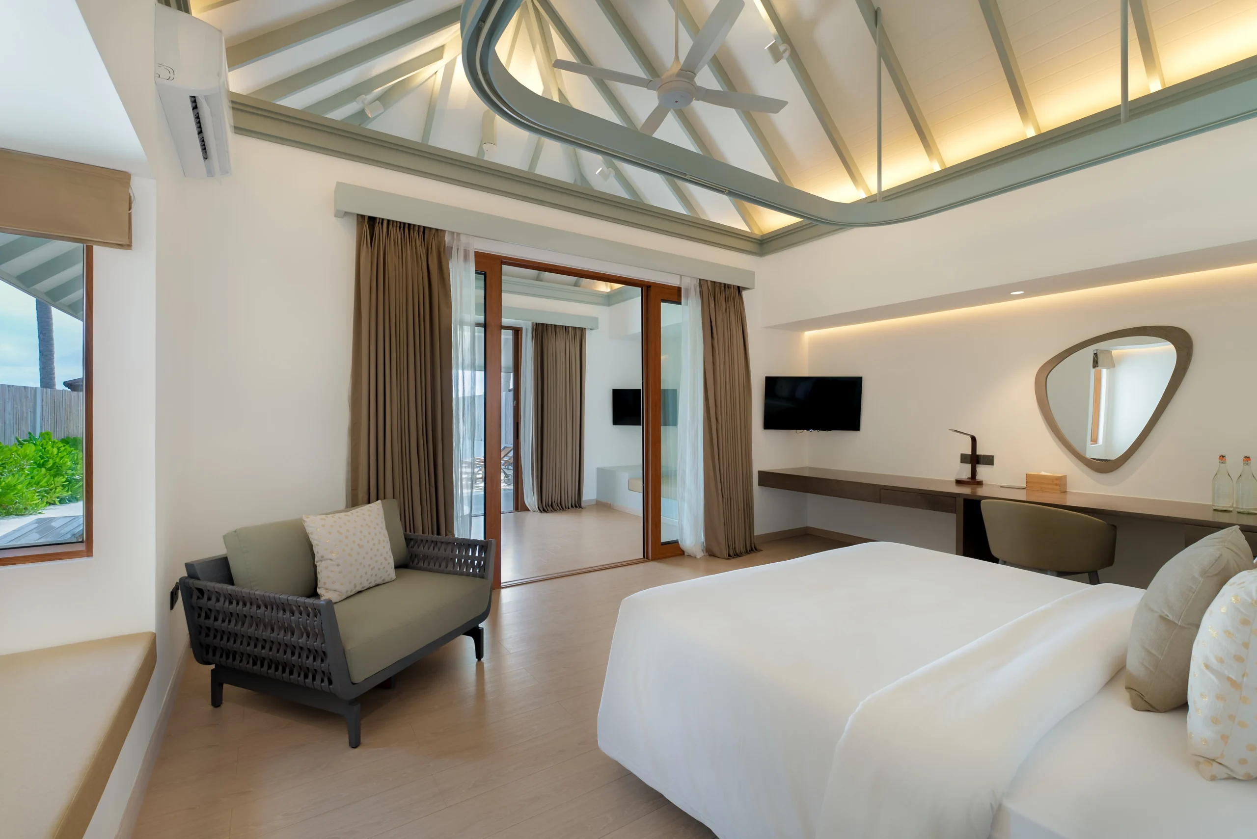interior of a grand beach suite with pool at sun siyam olhuveli maldives featuring contemporary furnishings and spacious beachfront accommodation