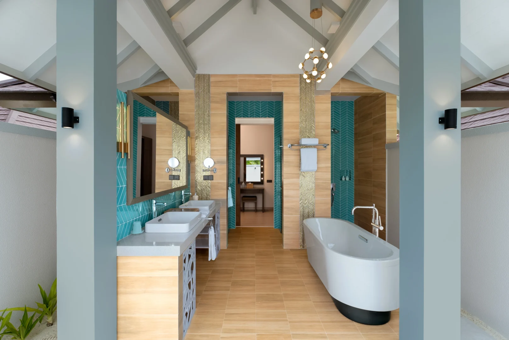 bathroom in a grand beach suite with pool at sun siyam olhuveli maldives featuring contemporary design and modern amenities