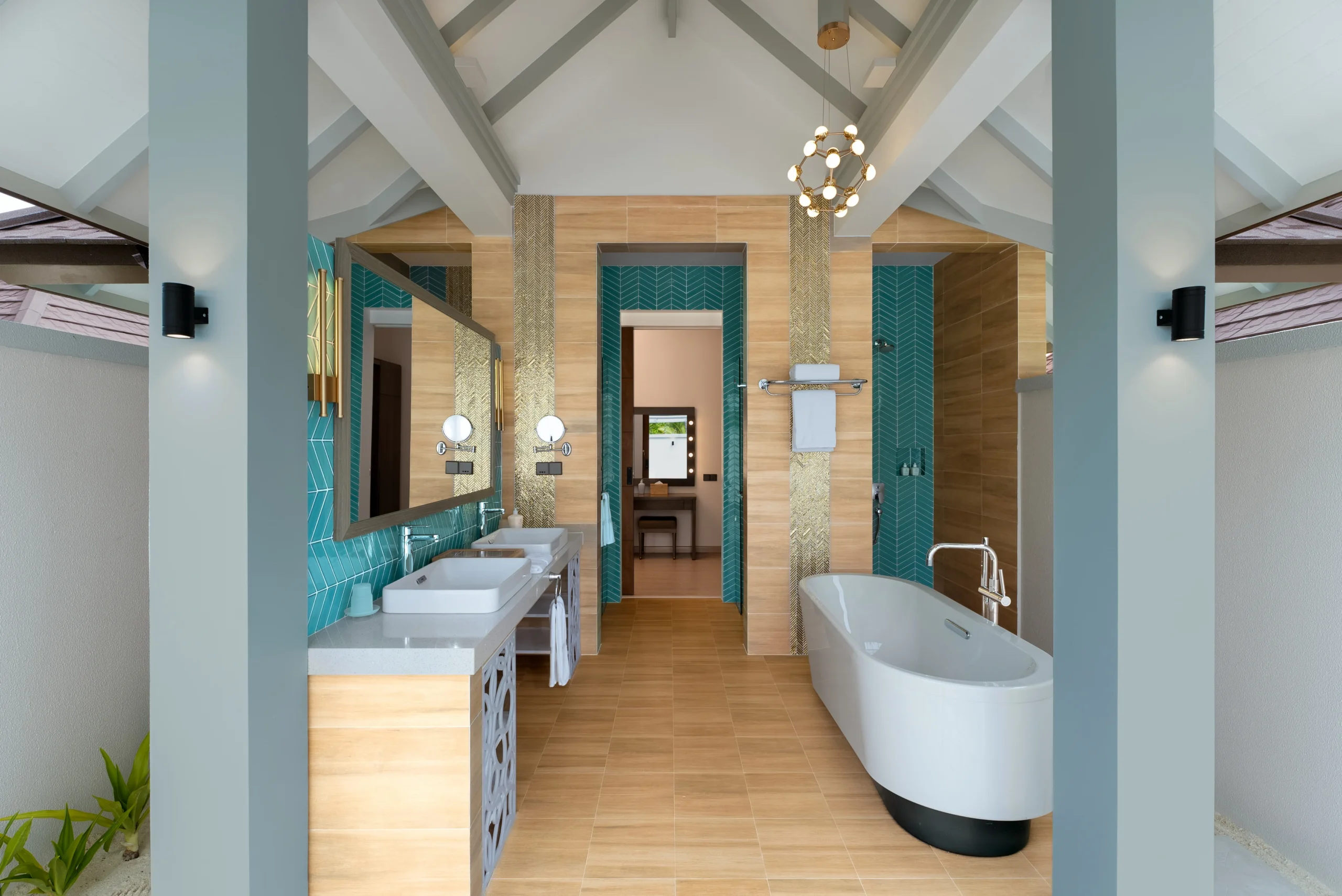 bathroom in a grand beach suite with pool at sun siyam olhuveli maldives featuring contemporary design and modern amenities