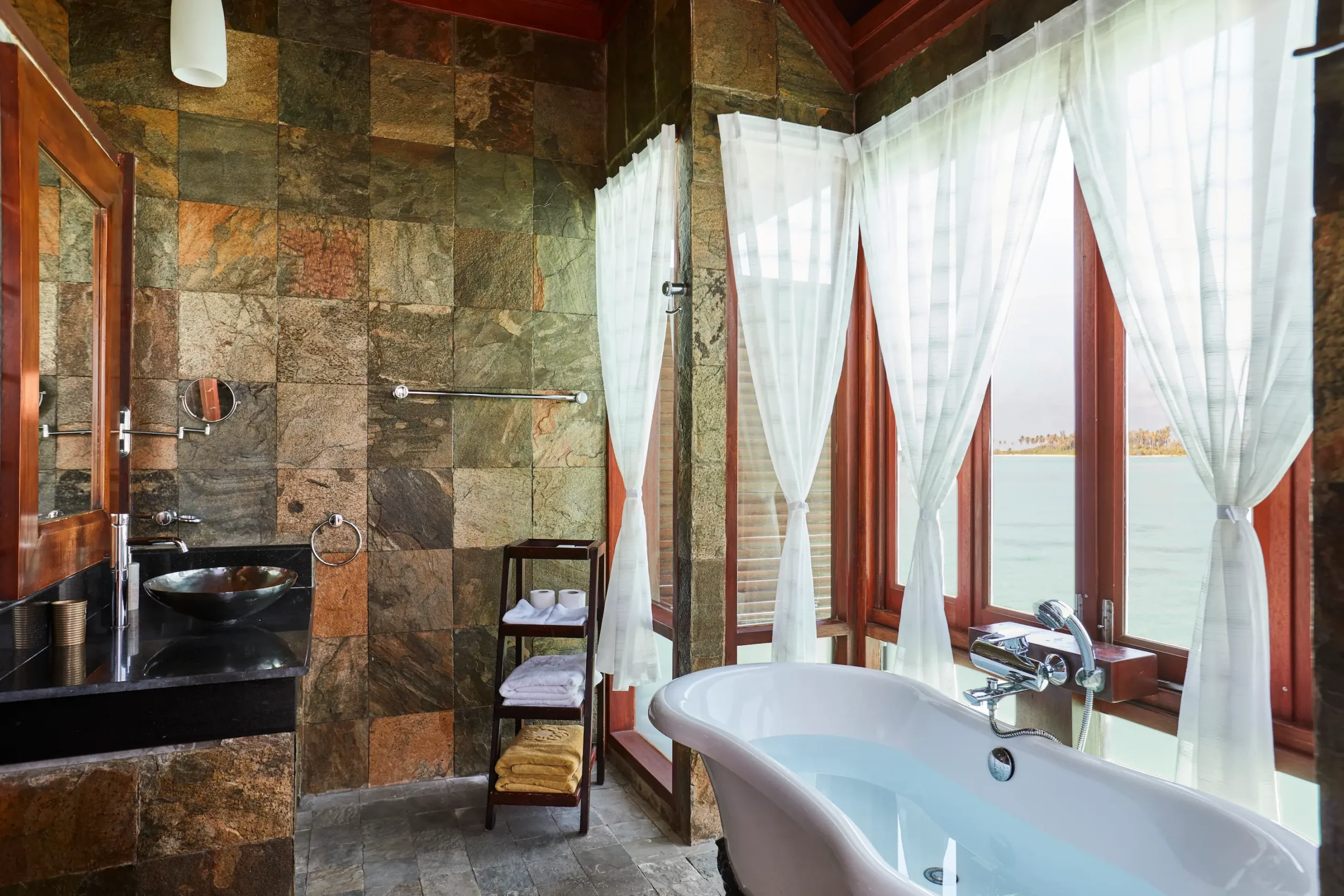 bathroom in a prestige jacuzzi water villa at sun siyam olhuveli maldives featuring contemporary design and modern amenities