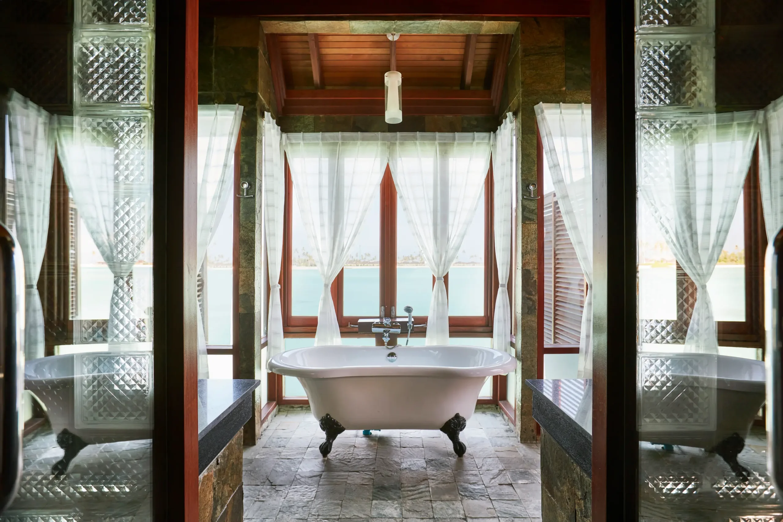 bathtub in a prestige jacuzzi water villa at sun siyam olhuveli maldives featuring contemporary bathroom design