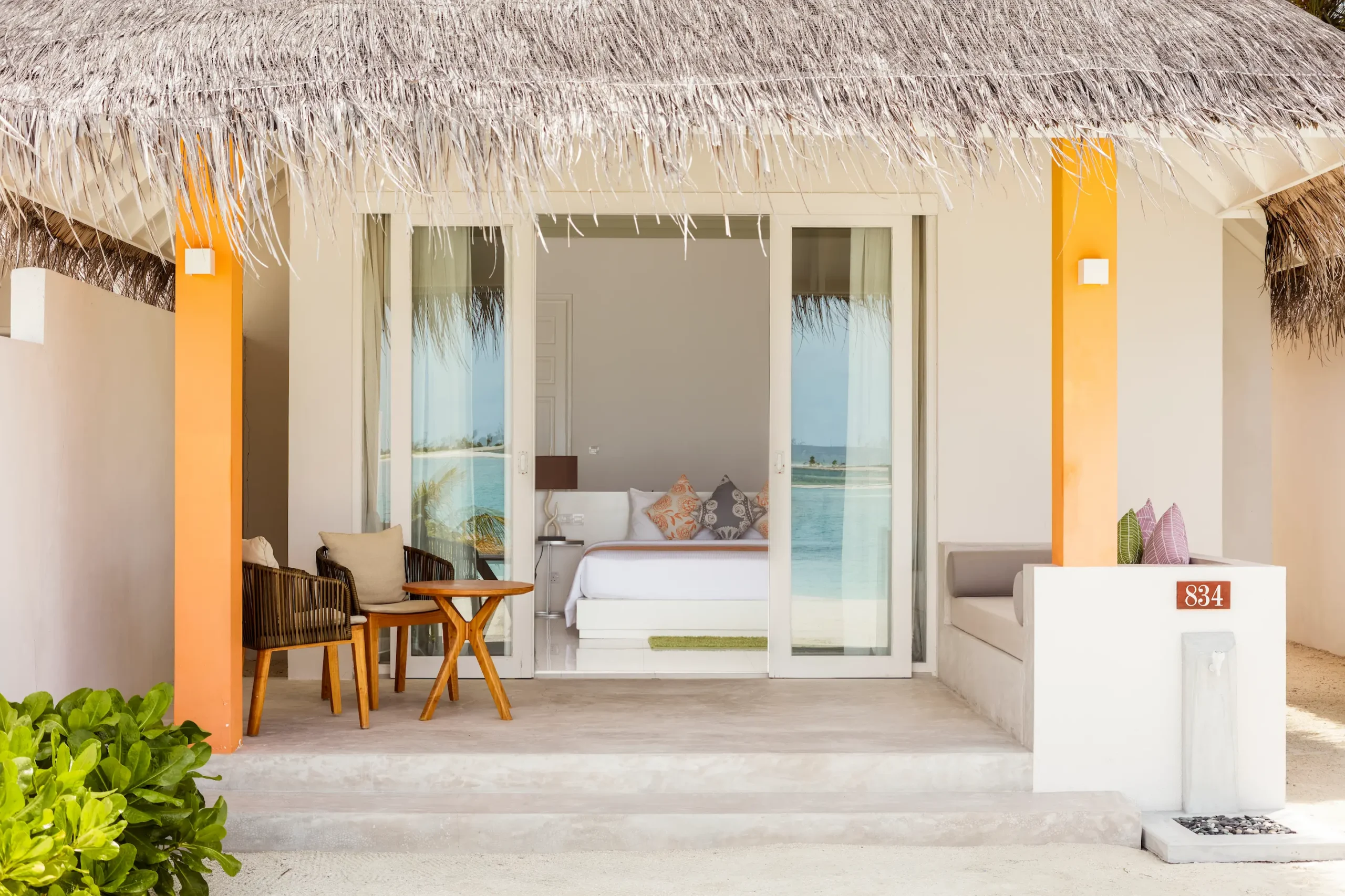 private terrace of a grand beach villa at sun siyam olhuveli maldives with outdoor seating and direct beach access