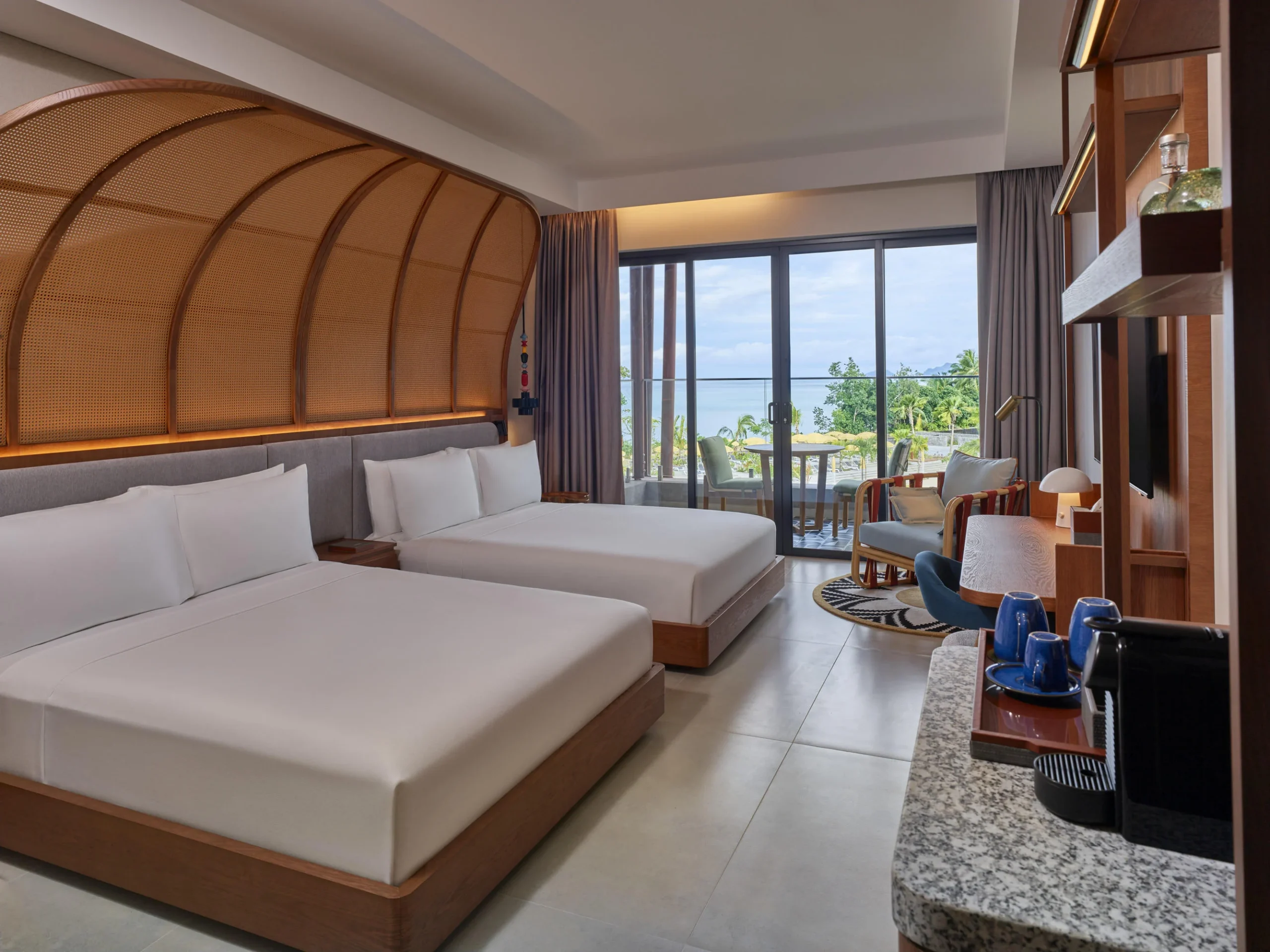 Twin Room with Pool View at Canopy by Hilton Seychelles Resort in Mahé, Seychelles, featuring two beds, a private balcony and views of the resort swimming pool.