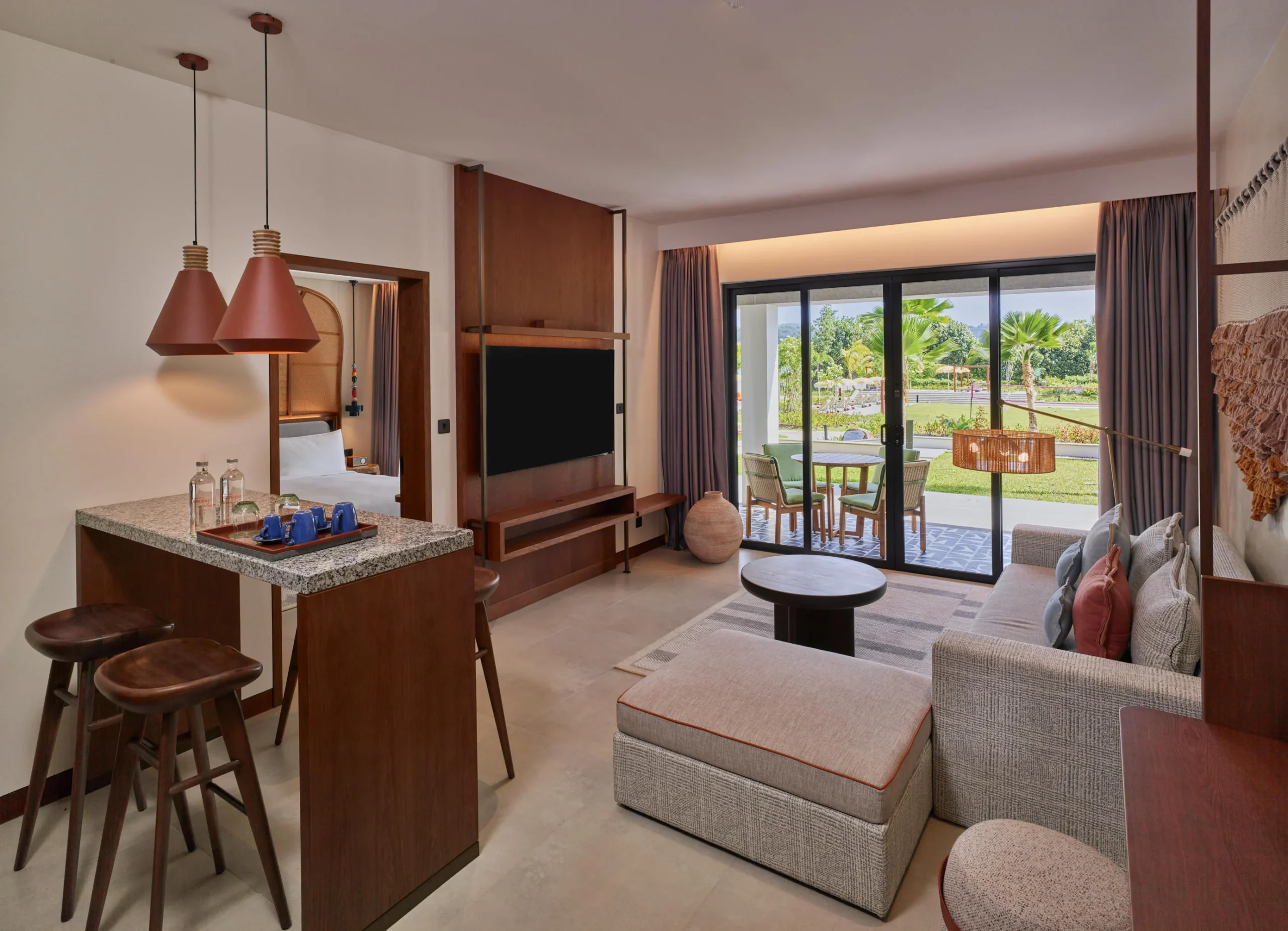 Living area in the One Bedroom Suite at Canopy by Hilton Seychelles Resort in Mahé, Seychelles, featuring separate lounge space and contemporary island-inspired design.