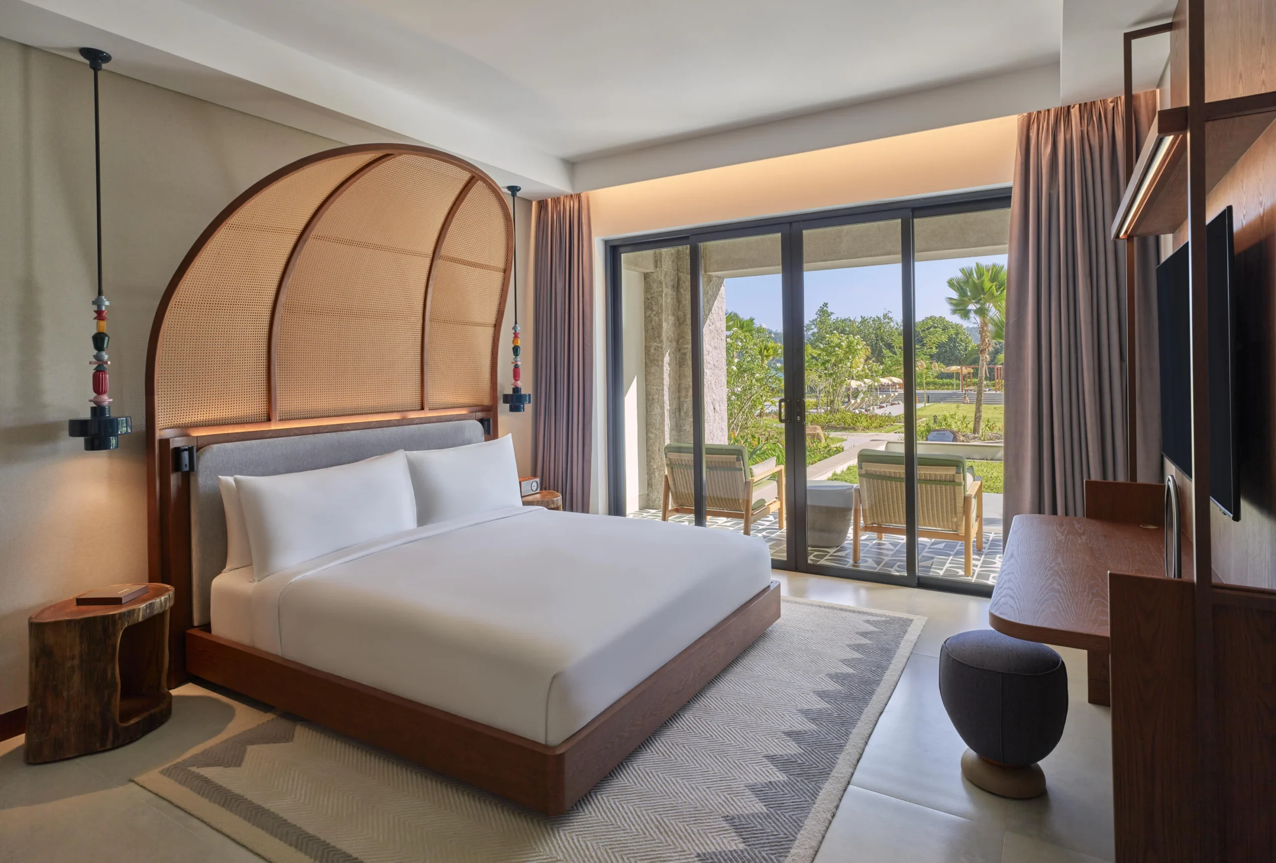 View from the One Bedroom Suite at Canopy by Hilton Seychelles Resort in Mahé, Seychelles, overlooking the resort's surrounding landscape from a private balcony.