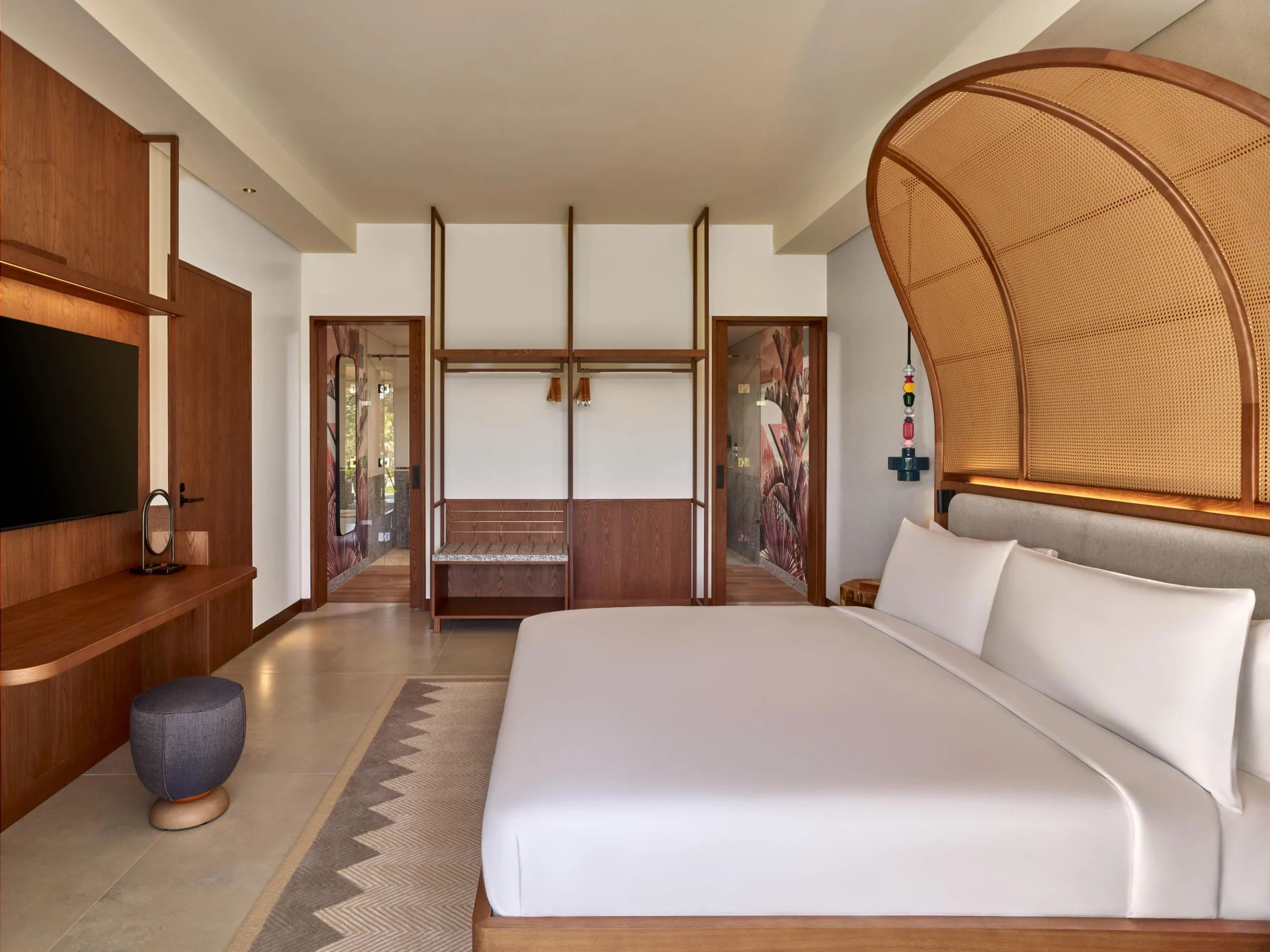 Interior of the One Bedroom Suite at Canopy by Hilton Seychelles Resort in Mahé, Seychelles, featuring separate living and sleeping areas with contemporary island-inspired design.