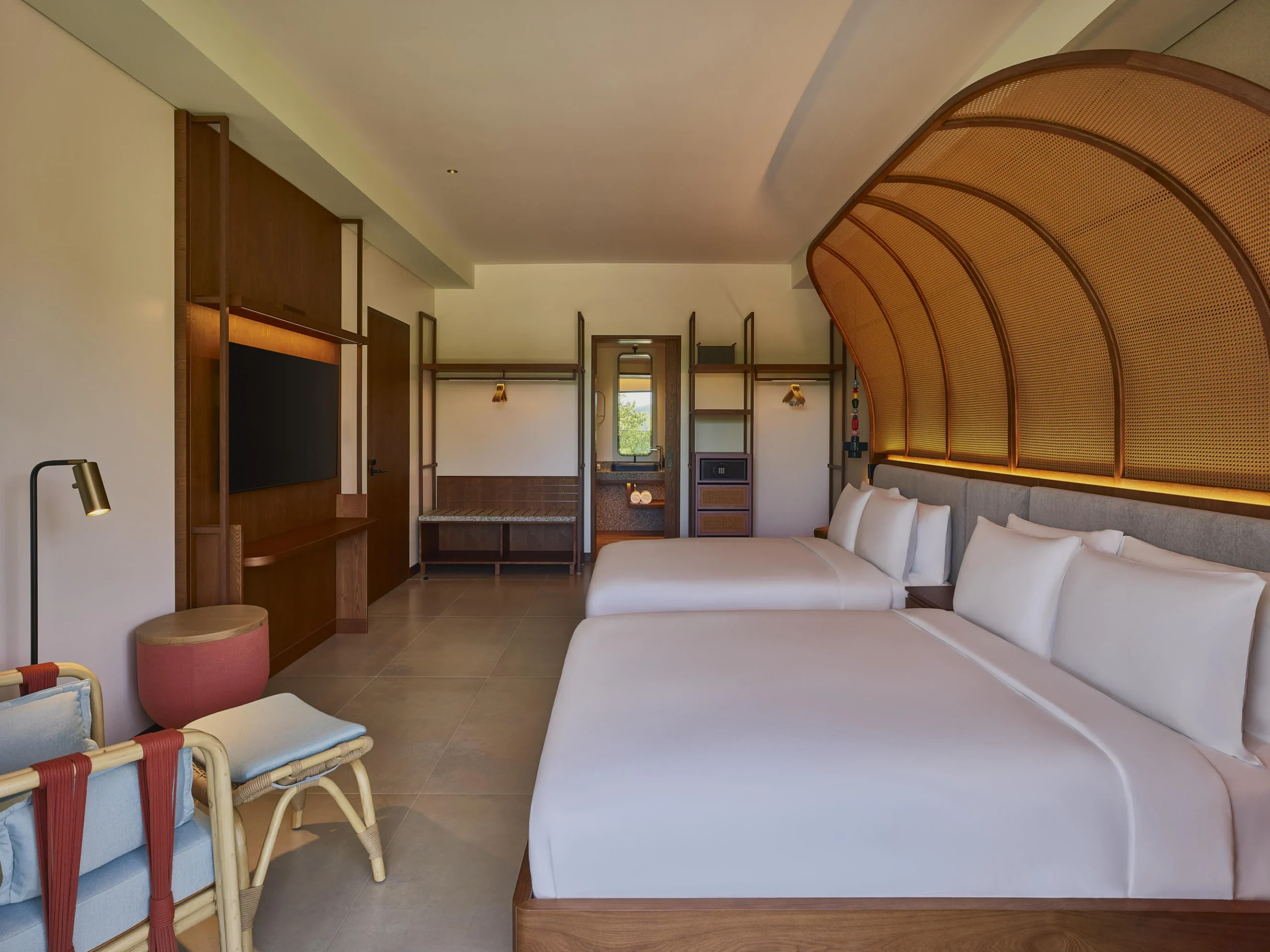 Twin bedroom in the Two Bedroom Suite at Canopy by Hilton Seychelles Resort in Mahé, Seychelles, featuring twin beds and contemporary island-inspired décor.