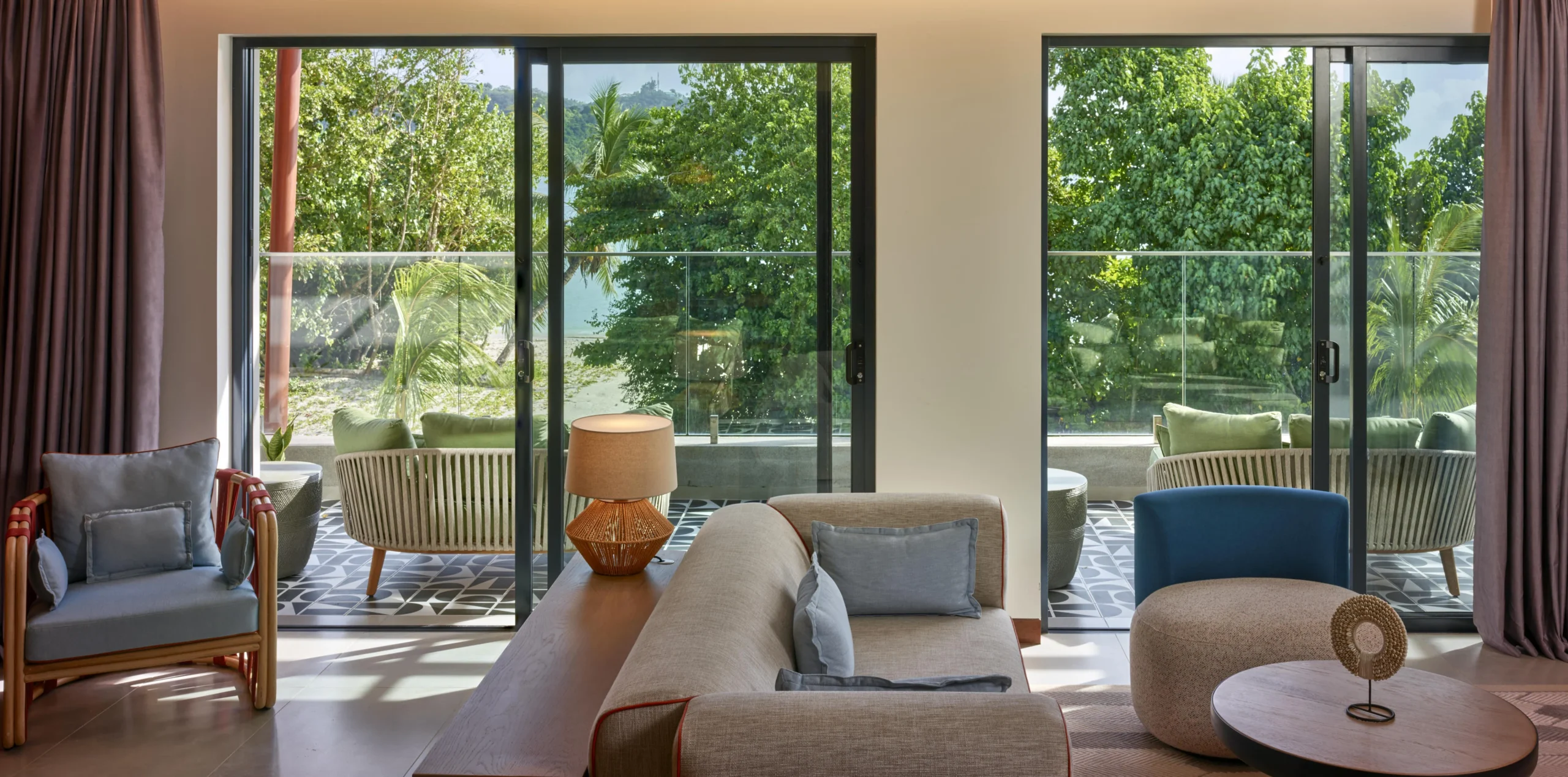 View from the Two Bedroom Suite at Canopy by Hilton Seychelles Resort in Mahé, Seychelles, overlooking the resort surroundings from a private balcony.