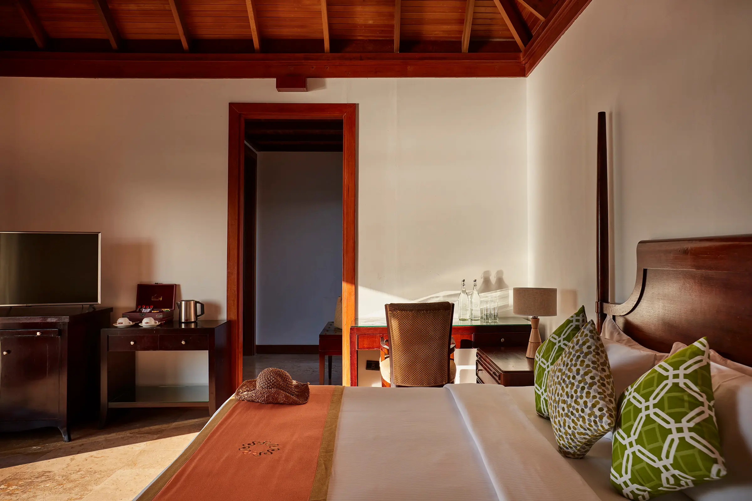 bedroom in a prestige jacuzzi water villa at sun siyam olhuveli maldives featuring contemporary furnishings and overwater accommodation