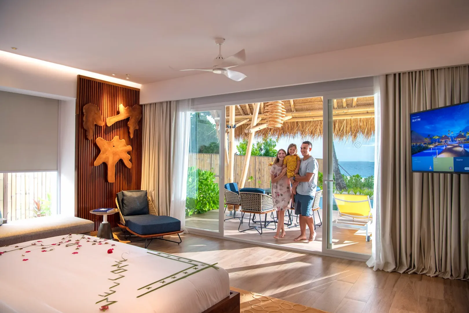 family enjoying a stay at a family beach villa with pool at emerald maldives resort & spa in the maldives with direct beach access and spacious outdoor living areas