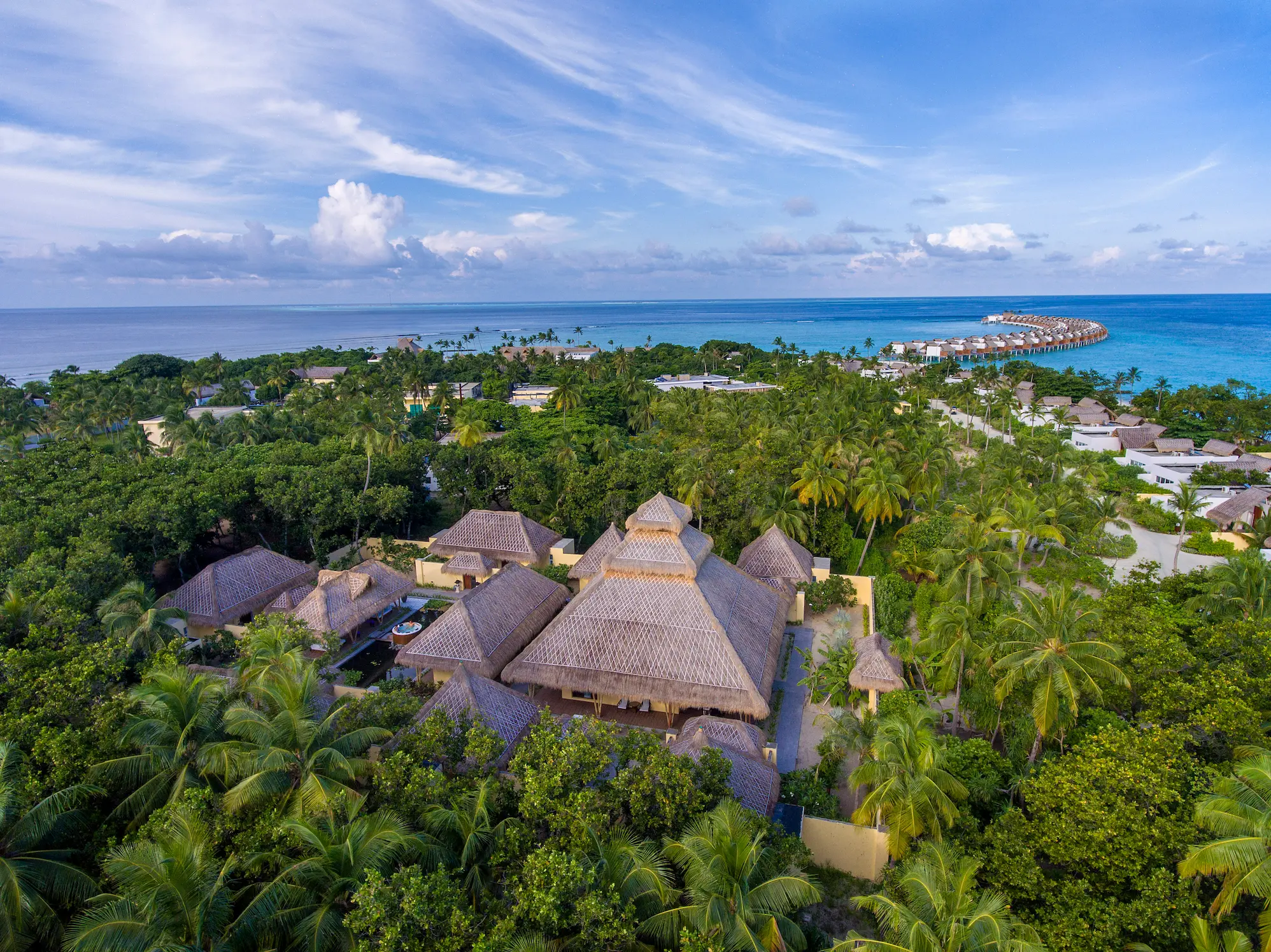 aerial view of the emerald spa at emerald maldives resort & spa in the maldives surrounded by tropical greenery and wellness facilities