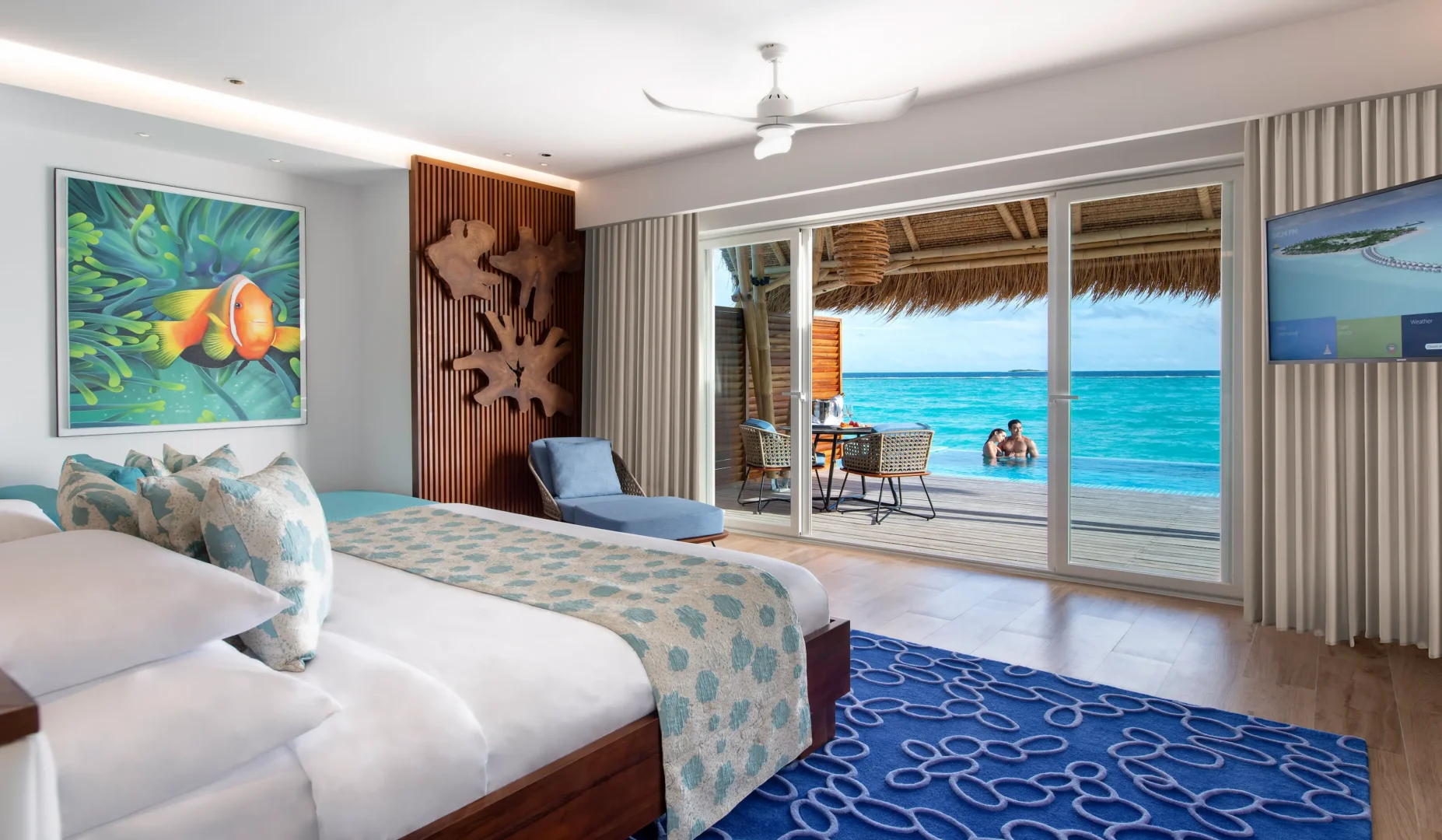 interior of a water villa with pool at emerald maldives resort & spa in the maldives featuring contemporary furnishings, spacious living areas and direct access to a private overwater sundeck and pool