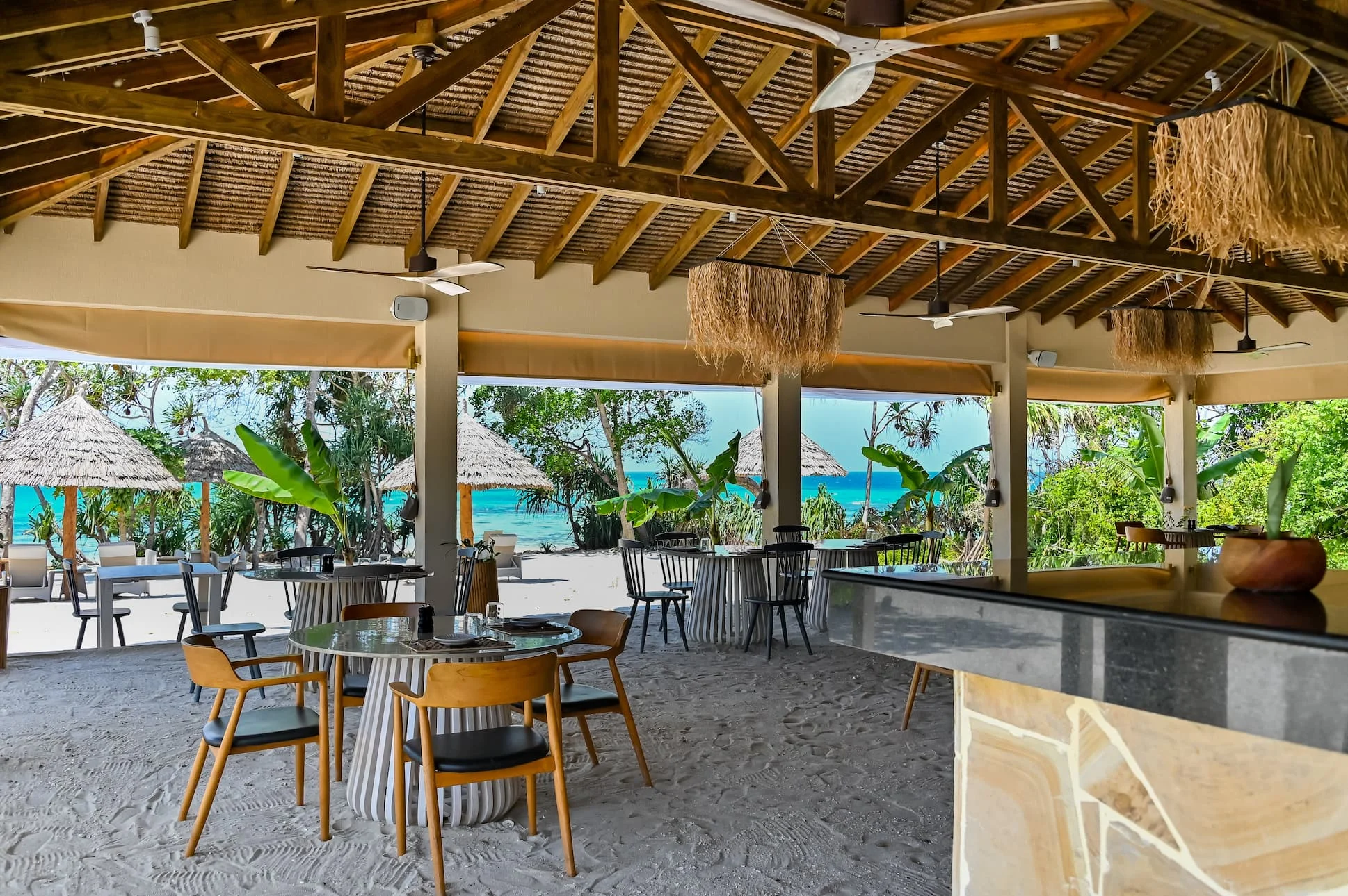 Beachfront dining at The Beach Club restaurant at Bawe Island private island resort, Zanzibar