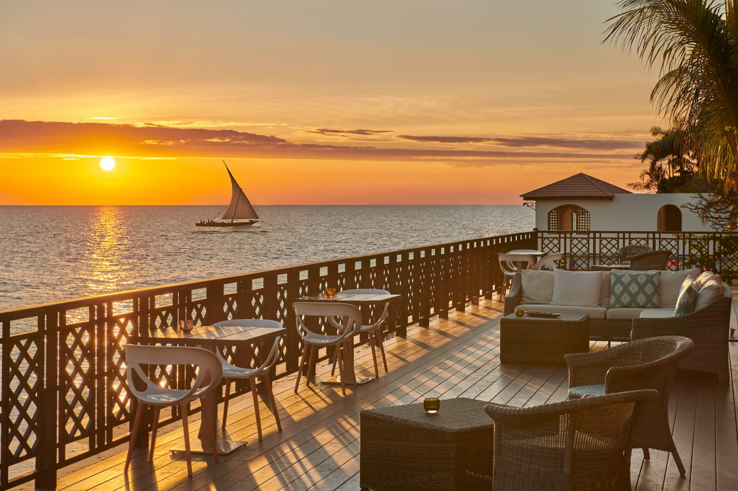 Beach House at Park Hyatt Zanzibar during sunset, featuring oceanfront dining, coastal views and a relaxed waterfront atmosphere in Stone Town.