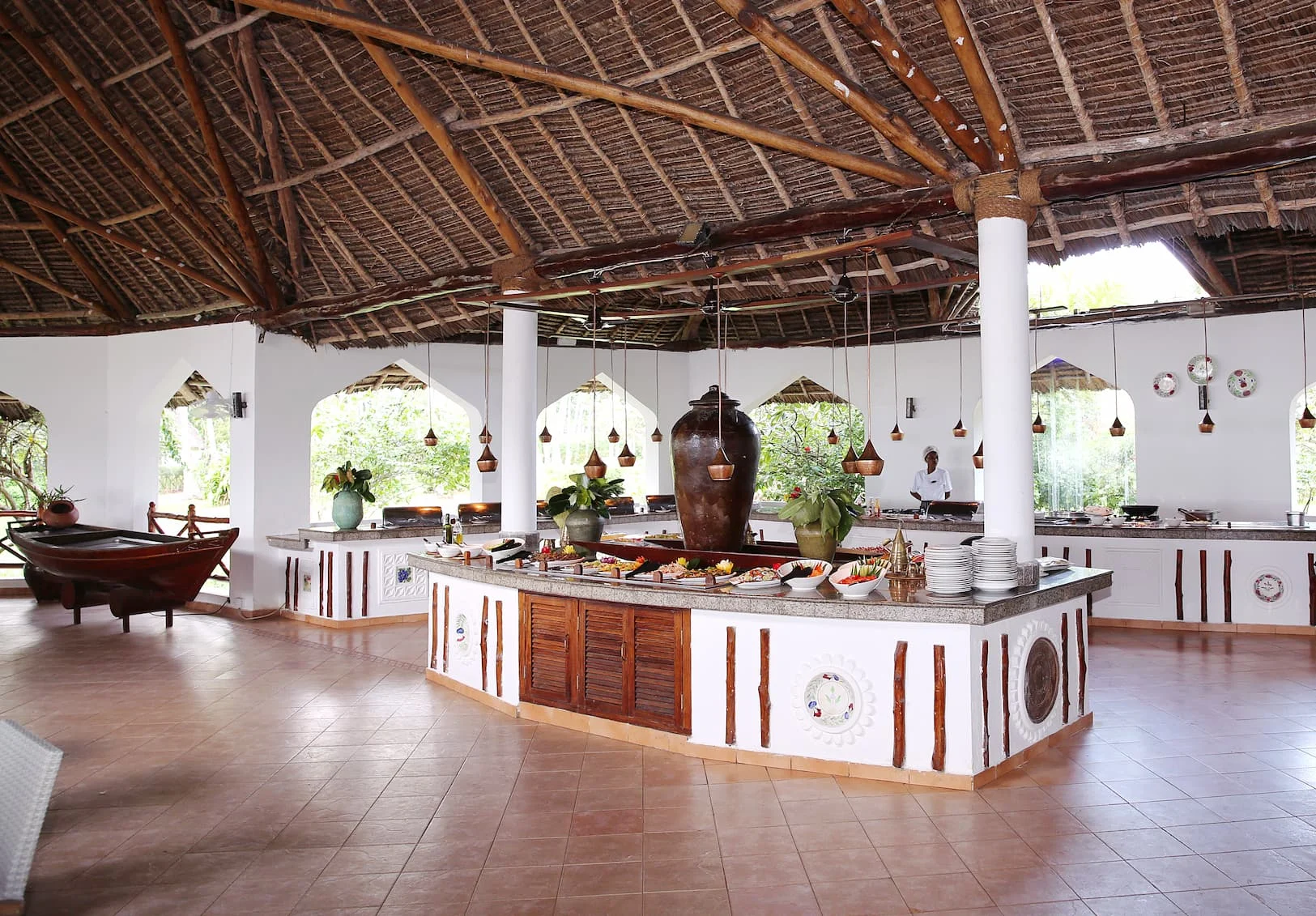 Makuti Restaurant at Bluebay Beach Resort & Spa serving buffet dining with views across the swimming pool and Indian Ocean.