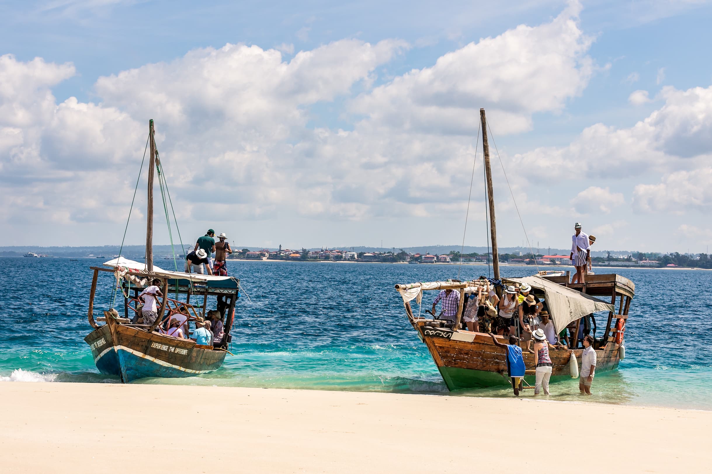 Sand bank arrival experience from Park Hyatt Zanzibar featuring a secluded sandbank surrounded by the Indian Ocean and accessible by boat excursion.