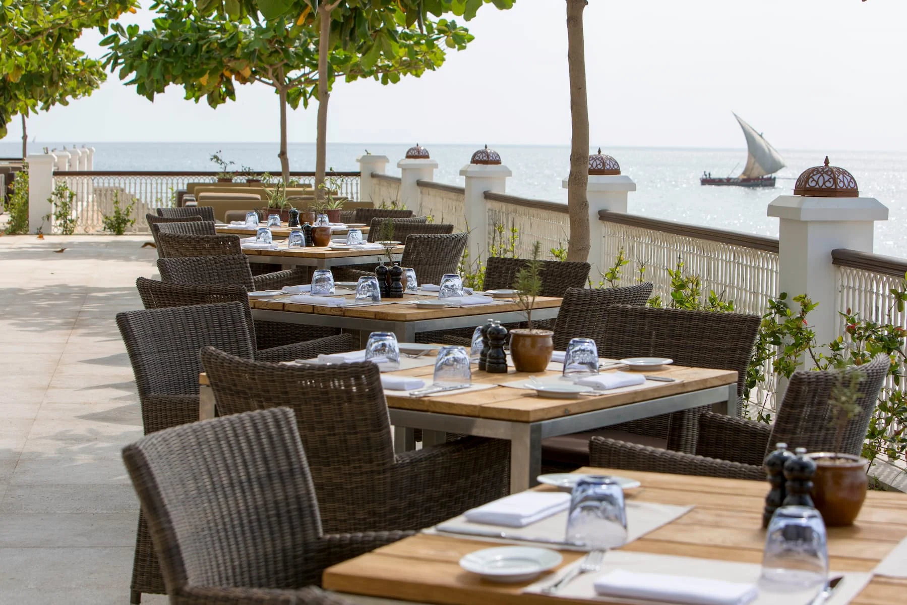 Dining Room Terrace at Park Hyatt Zanzibar overlooking the Indian Ocean, offering outdoor dining with views of Stone Town's waterfront and dhow harbour.