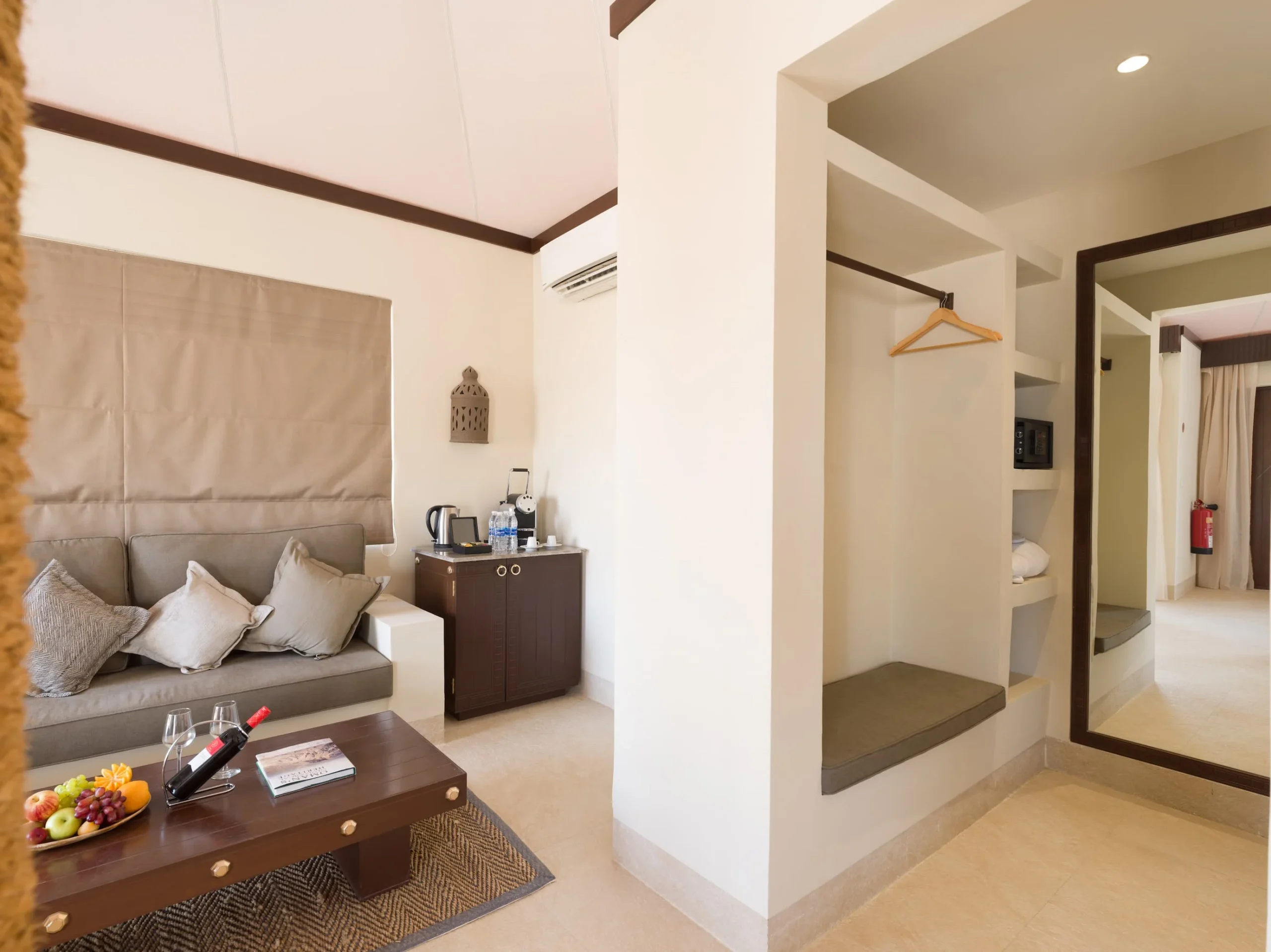 Bedroom interior of a Premier Villa at Desert Nights Resort Oman featuring a king bed and premium in-room amenities in the Wahiba Sands desert