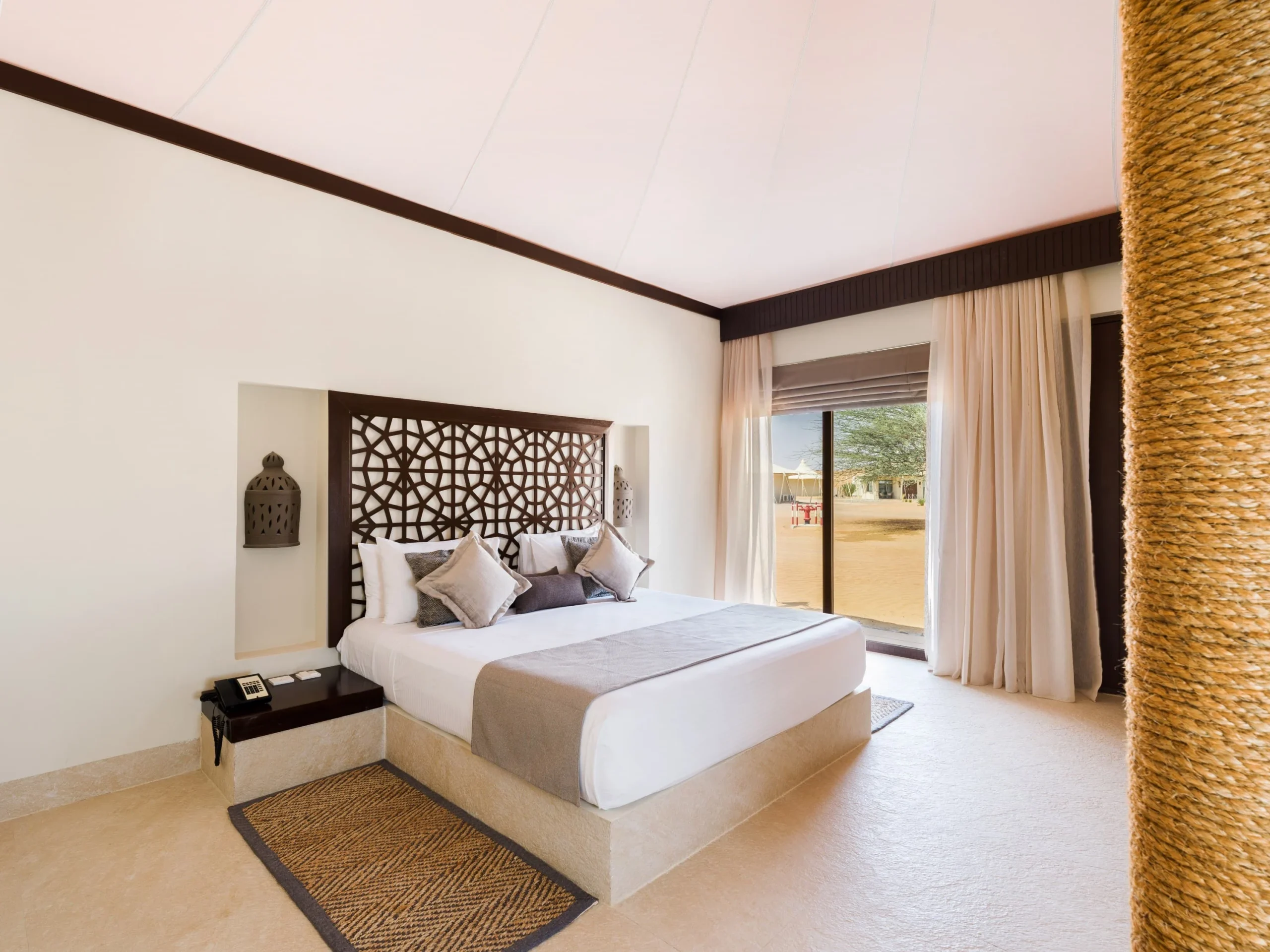 King bedroom in a Premier Villa at Desert Nights Resort Oman featuring spacious luxury accommodation in the Wahiba Sands desert
