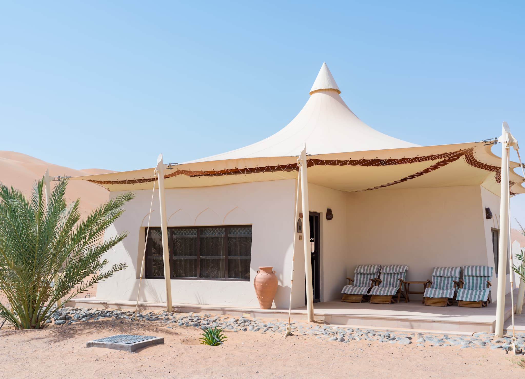 Exterior view of a Two Bedroom Villa at Desert Nights Resort Oman offering spacious family accommodation surrounded by the dunes of the Wahiba Sands desert