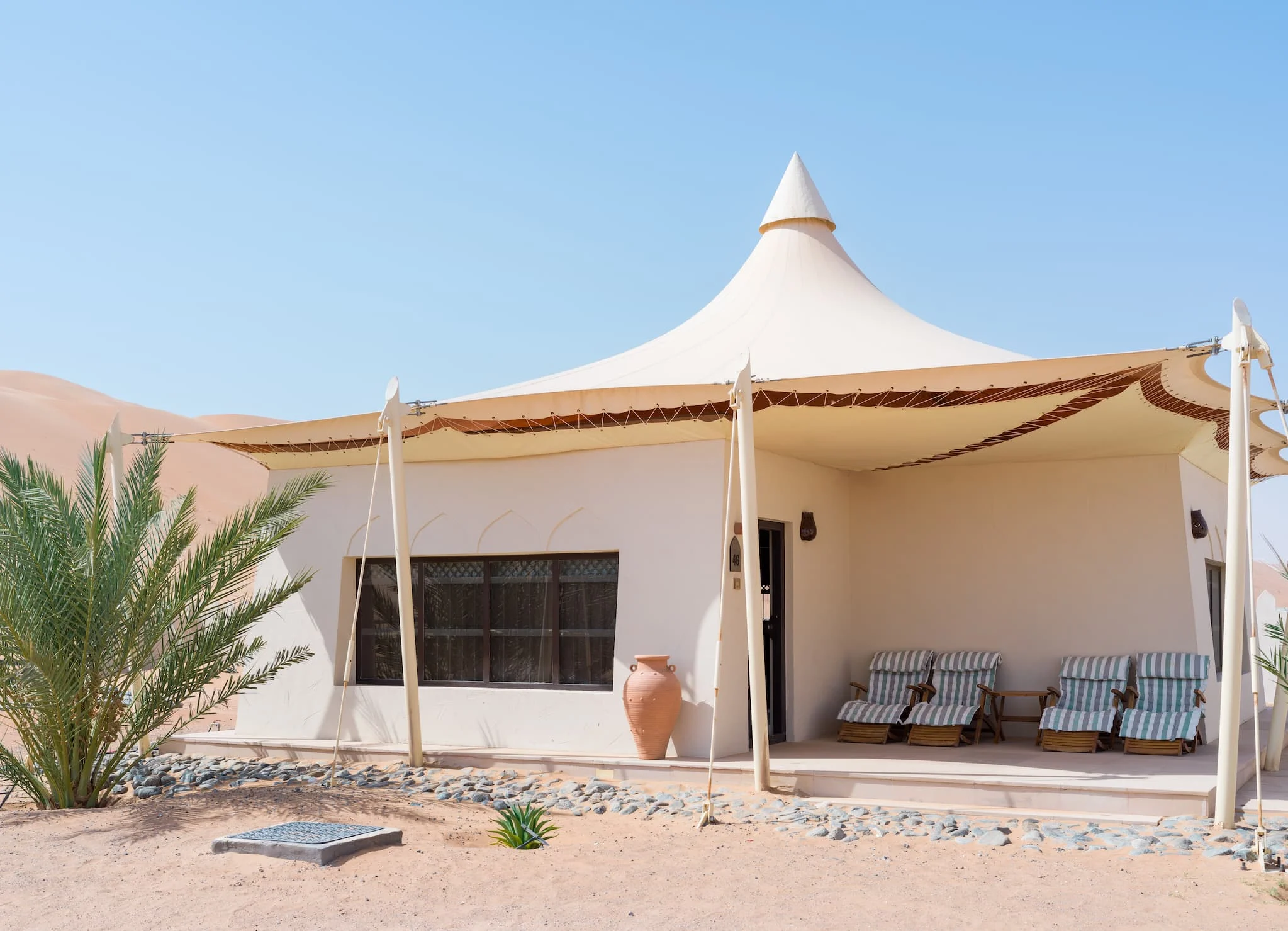 Exterior view of a Two Bedroom Villa at Desert Nights Resort Oman offering spacious family accommodation surrounded by the dunes of the Wahiba Sands desert