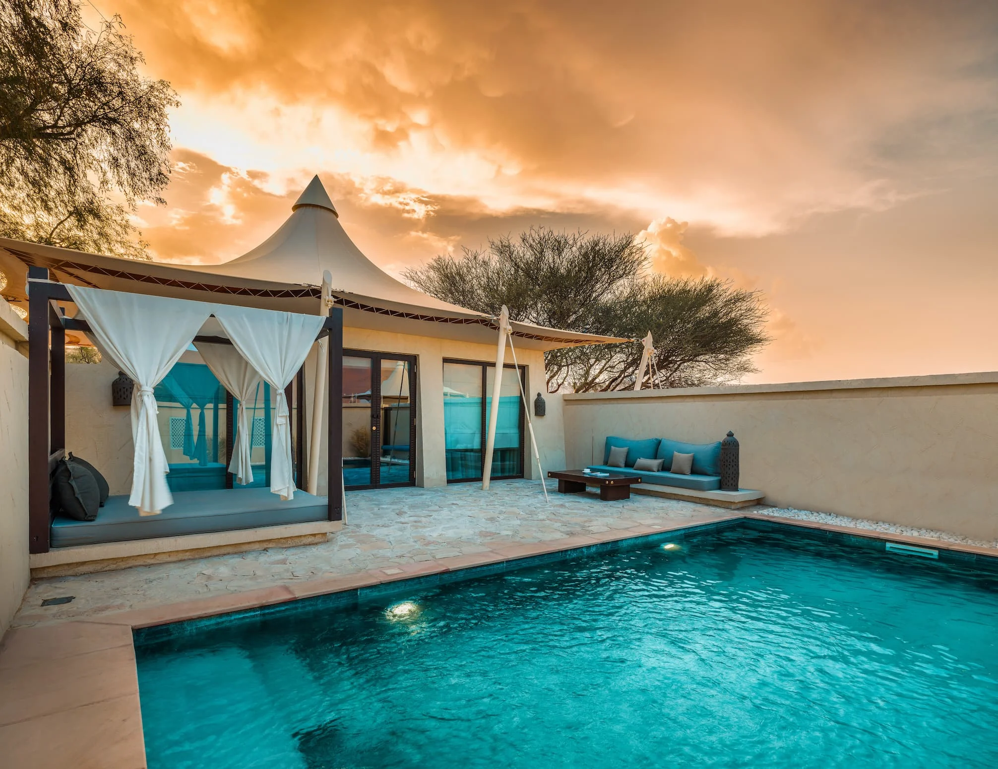 Exterior view of a Pool Villa at Desert Nights Resort Oman featuring a private pool and luxury desert accommodation in the Wahiba Sands