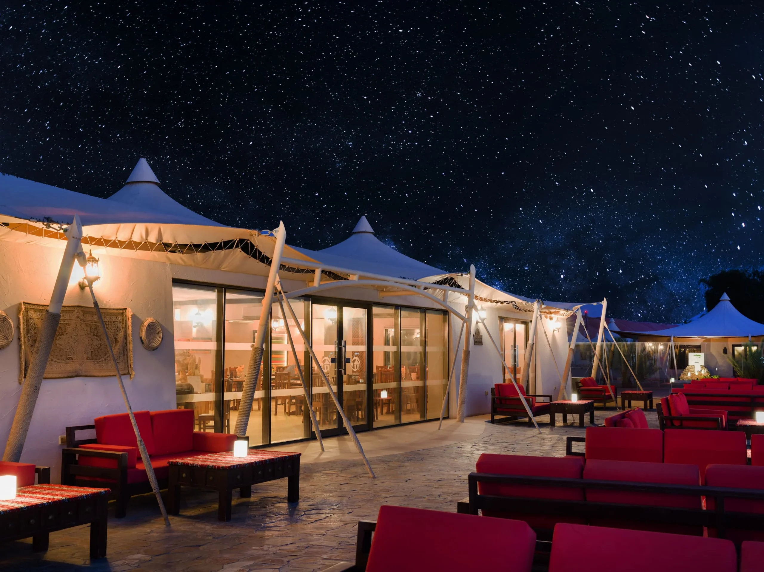 Evening dining at Desert Nights Resort Oman beneath a star-filled desert sky in the Wahiba Sands