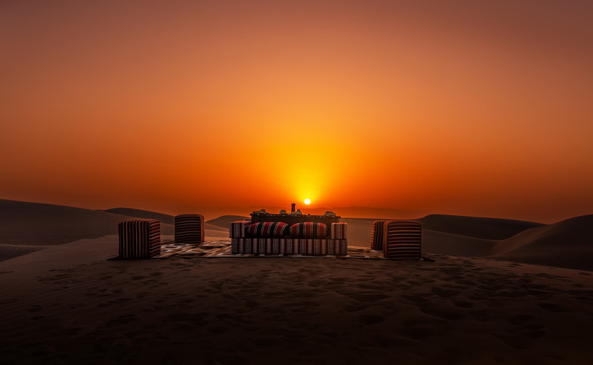 Sunrise breakfast experience overlooking the dunes of the Wahiba Sands at Desert Nights Resort Oman